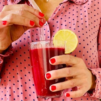 Beetroot juice with carrots, pear, turmeric, and lemon