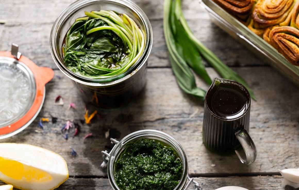 Wild garlic myeongi next to wild garlic pesto and wild garlic oil