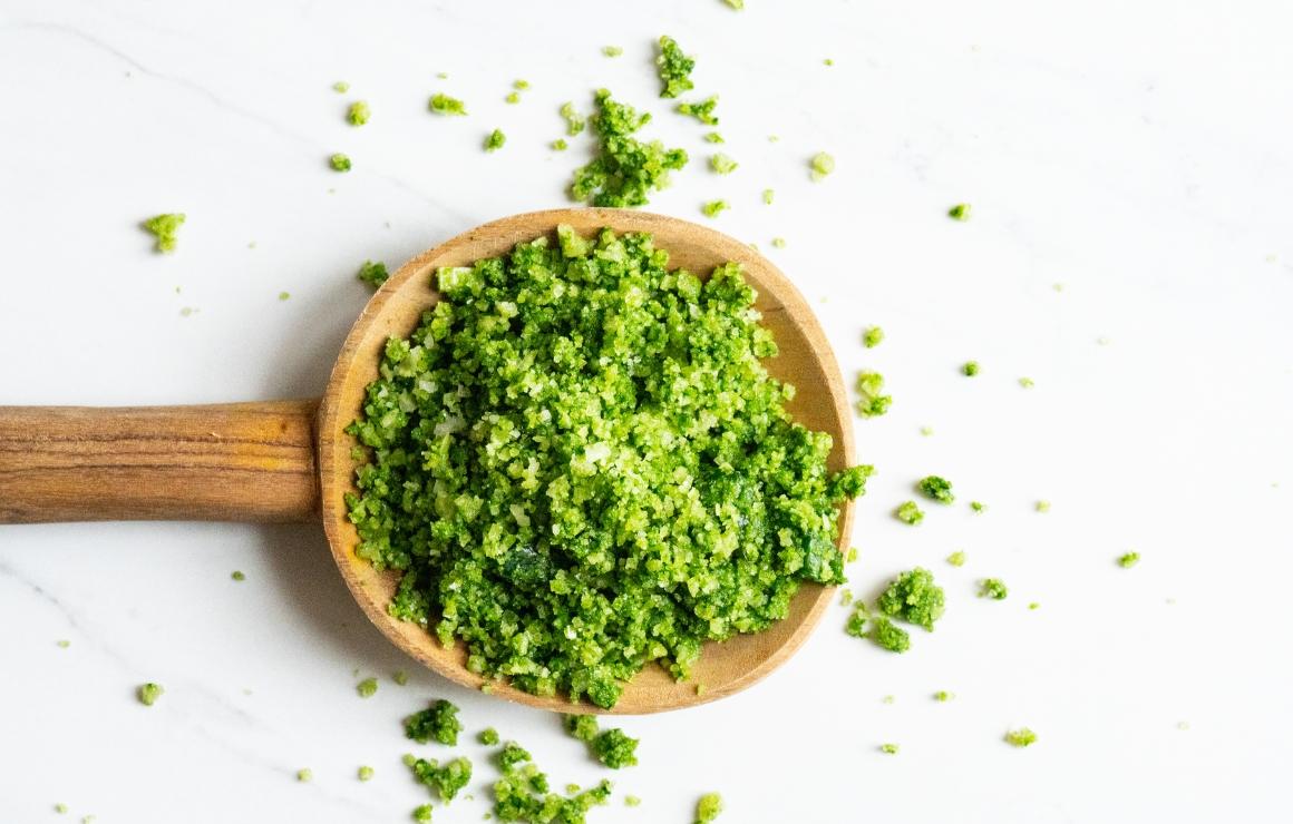 Wild garlic salt on a wooden spoon