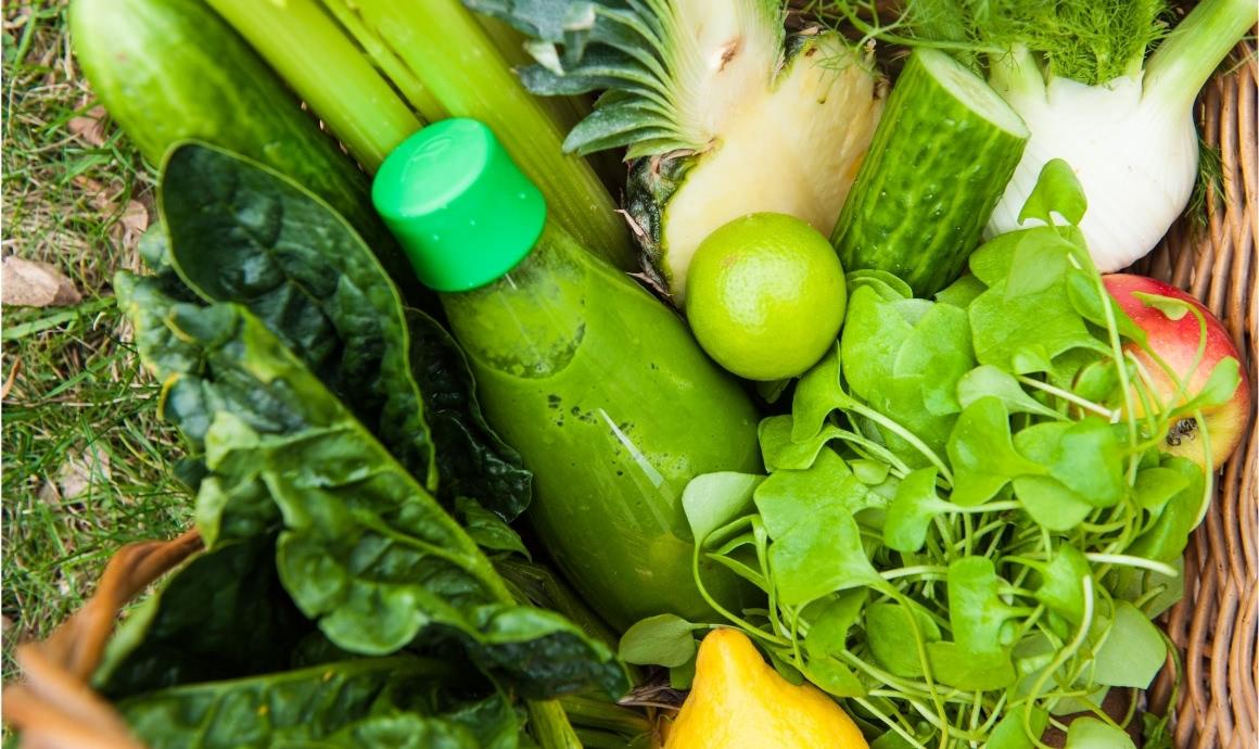 Shopping basket filled with Detox Smoothie ingredients and a bottle of Green Smoothie