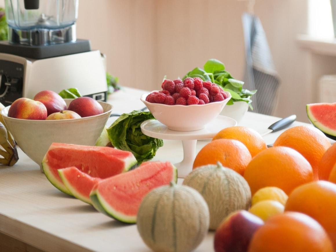 Table with cantaloupe- and sliced watermelon