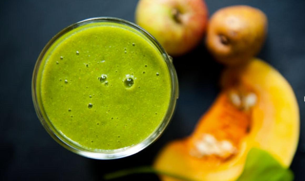 Pumpkin smoothie in a glass, from above - with ingredients.