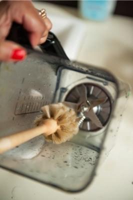 Cleaning brush in container